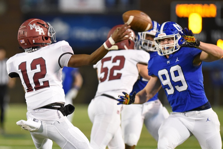 Staff Photo by Matt Hamilton / McCallie School (99) Jay Williams gets in the face of Montgomery Bell Academy (12) Marcel Reed on Thursday, December 2, 2021 at Finley Stadium. McCallie School played Montgomery Bell Academy in the Division II Class AAA State Football Playoffs on Thursday.
