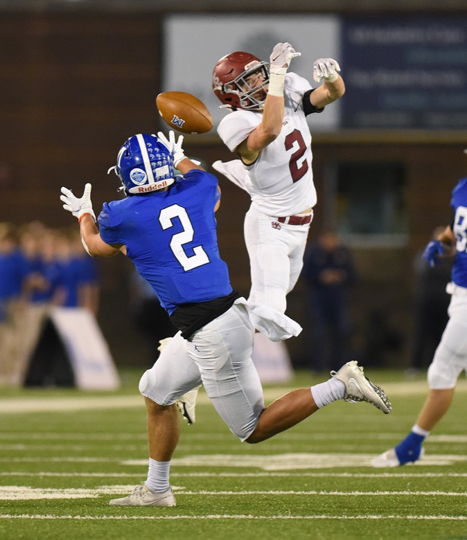 Staff Photo by Matt Hamilton / McCallie School (2) Xavier Gaillardetz catches a pass as it slips through the fingers of Montgomery Bell Academy (2) Payne Daniel on Thursday, December 2, 2021 at Finley Stadium. McCallie School played Montgomery Bell Academy in the Division II Class AAA State Football Playoffs on Thursday.