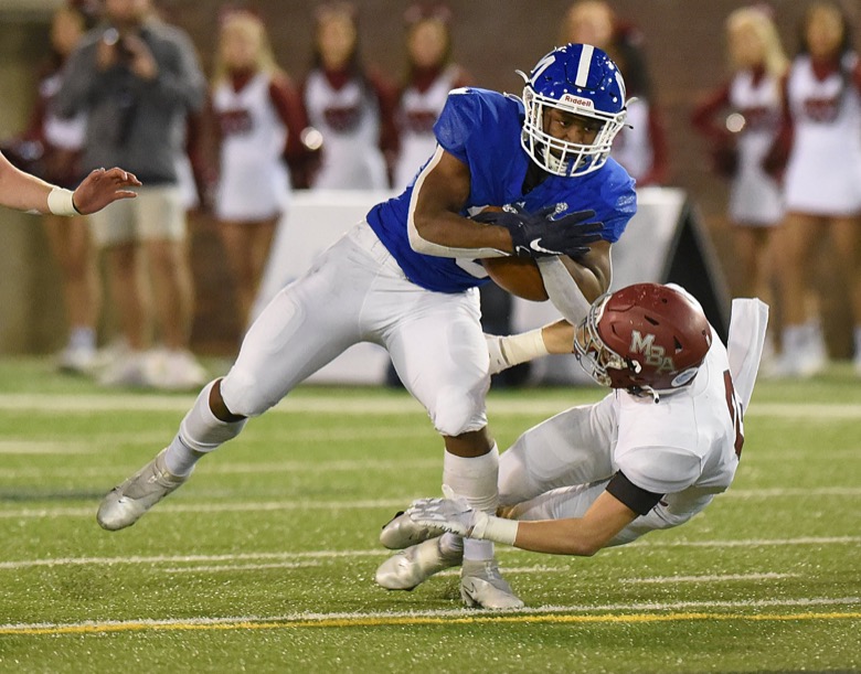Staff Photo by Matt Hamilton / McCallie School (10) Tario Price collides with a Montgomery Bell Academy defender as he carries the ball on Thursday, December 2, 2021 at Finley Stadium. McCallie School played Montgomery Bell Academy in the Division II Class AAA State Football Playoffs on Thursday.