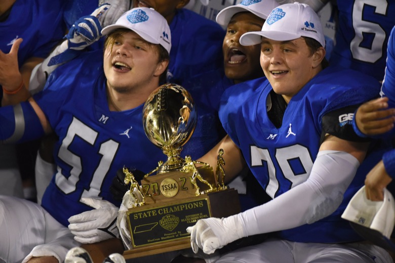Staff Photo by Matt Hamilton / McCallie School players hold the trophy after their win on Thursday, December 2, 2021 at Finley Stadium. McCallie School played Montgomery Bell Academy in the Division II Class AAA State Football Playoffs on Thursday.