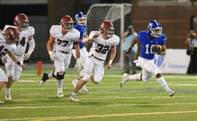 Staff Photo by Matt Hamilton / McCallie School (10) Tario Price bursts through the line as Montgomery Bell Academy defenders give chase on Thursday, December 2, 2021 at Finley Stadium. McCallie School played Montgomery Bell Academy in the Division II Class AAA State Football Playoffs on Thursday.