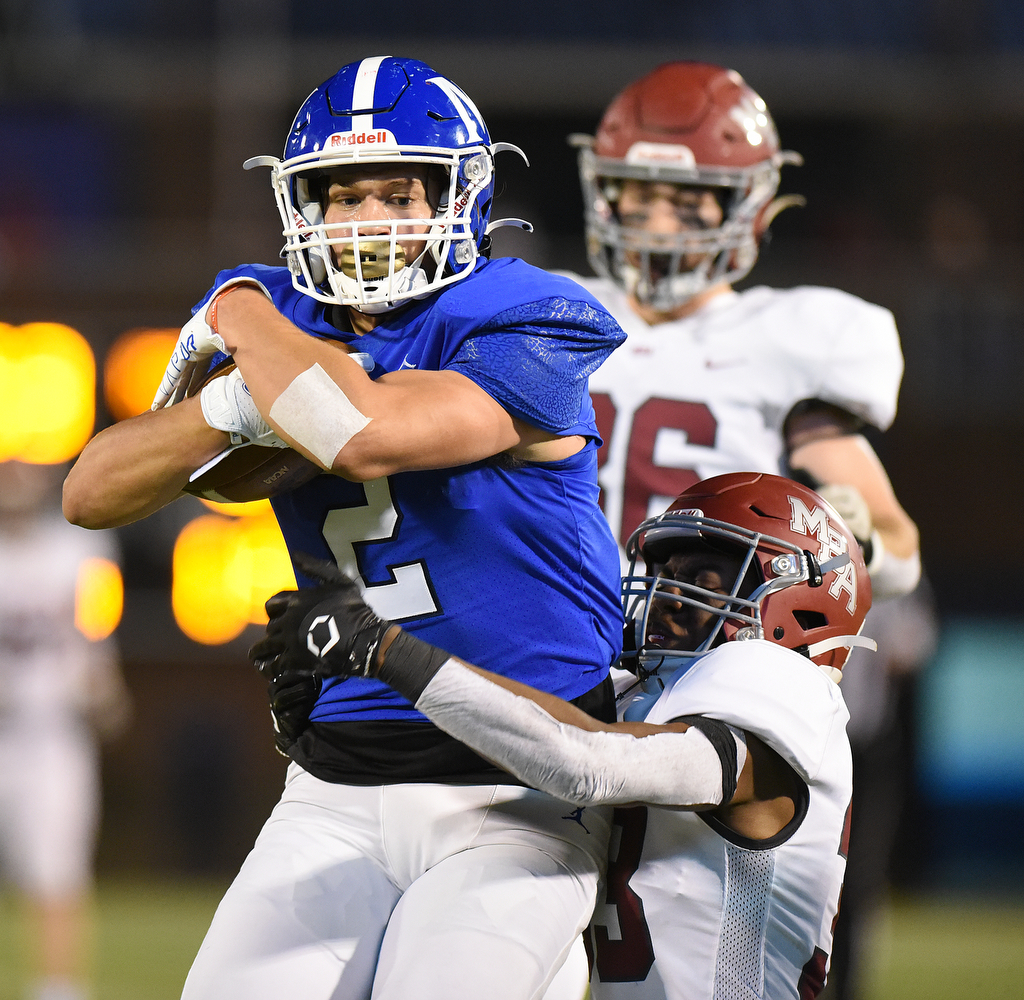 Staff Photo by Matt Hamilton / McCallie School (2) Xavier Gaillardetz carries the ball and a defender into the end zone for a touchdown on Thursday, December 2, 2021 at Finley Stadium. McCallie School played Montgomery Bell Academy in the Division II Class AAA State Football Playoffs on Thursday.