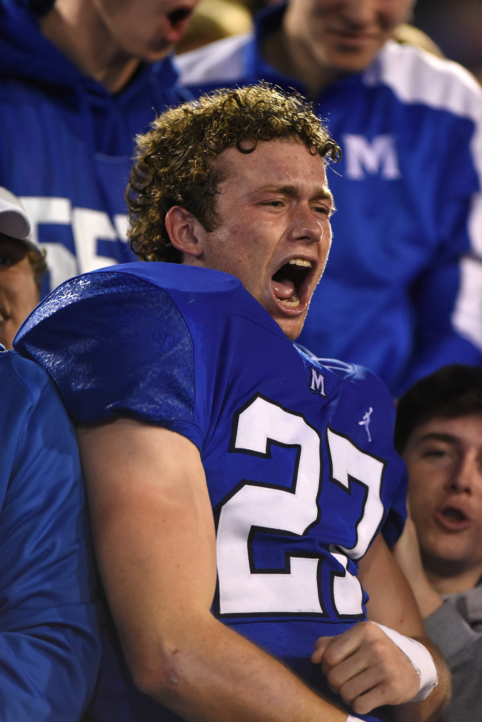 Staff Photo by Matt Hamilton / McCallie School (27) John Kohl McAdams celebrates with the student section after their win on Thursday, December 2, 2021 at Finley Stadium. McCallie School played Montgomery Bell Academy in the Division II Class AAA State Football Playoffs on Thursday.