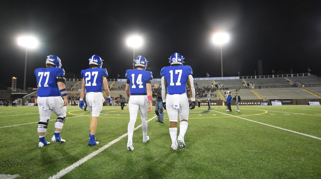 Staff Photo by Matt Hamilton / McCallie School team captains walk out to the coin toss on Thursday, December 2, 2021 at Finley Stadium. McCallie School played Montgomery Bell Academy in the Division II Class AAA State Football Playoffs on Thursday.