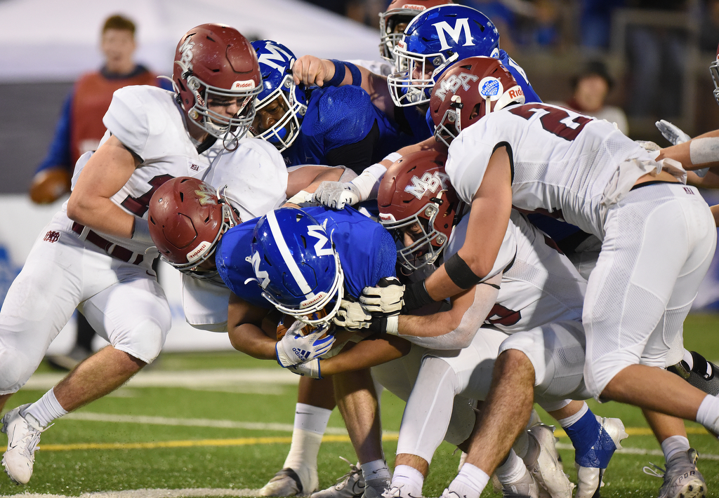 Staff Photo by Matt Hamilton / McCallie School (21) Damian Scott powers into the end zone for a touchdown on Thursday, December 2, 2021 at Finley Stadium. McCallie School played Montgomery Bell Academy in the Division II Class AAA State Football Playoffs on Thursday.