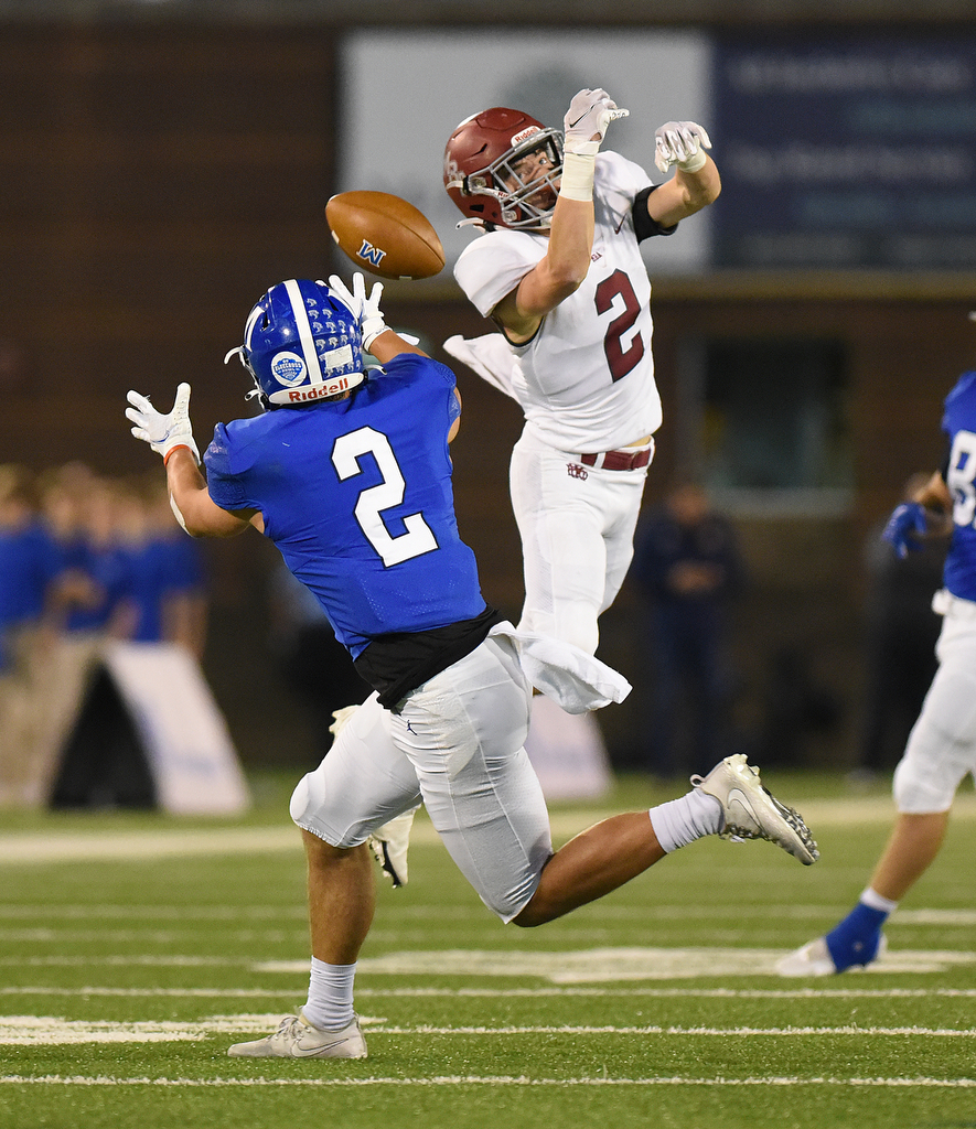 Staff Photo by Matt Hamilton / McCallie School (2) Xavier Gaillardetz catches a pass as it slips through the fingers of Montgomery Bell Academy (2) Payne Daniel on Thursday, December 2, 2021 at Finley Stadium. McCallie School played Montgomery Bell Academy in the Division II Class AAA State Football Playoffs on Thursday.