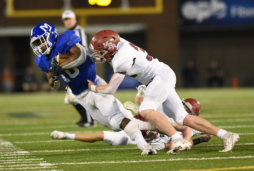 Staff Photo by Matt Hamilton / McCallie School (10) Tario Price carries the ball on Thursday, December 2, 2021 at Finley Stadium. McCallie School played Montgomery Bell Academy in the Division II Class AAA State Football Playoffs on Thursday.