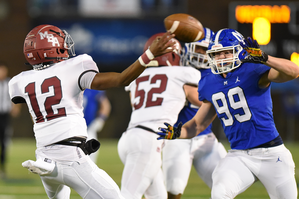 Staff Photo by Matt Hamilton / McCallie School (99) Jay Williams gets in the face of Montgomery Bell Academy (12) Marcel Reed on Thursday, December 2, 2021 at Finley Stadium. McCallie School played Montgomery Bell Academy in the Division II Class AAA State Football Playoffs on Thursday.