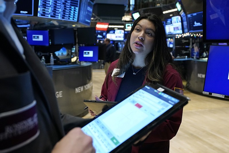 Trader Ashley Lara works on the floor of the New York Stock Exchange, Thursday, Dec. 2, 2021. Stocks are opening mostly higher on Wall Street Thursday as investors continue to monitor the spread of the new coronavirus variant as well as measures that the U.S. and other governments are taking to restrain it. (AP Photo/Richard Drew)