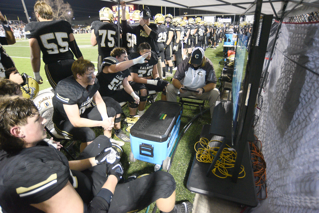 Staff Photo by Matt Hamilton / Calhoun High offensive linemen watch game film on Friday, December 3, 2021 in Calhoun, Ga. Calhoun High hosted Blessed Trinity in a GHSA Class 5A football semifinal game Friday.