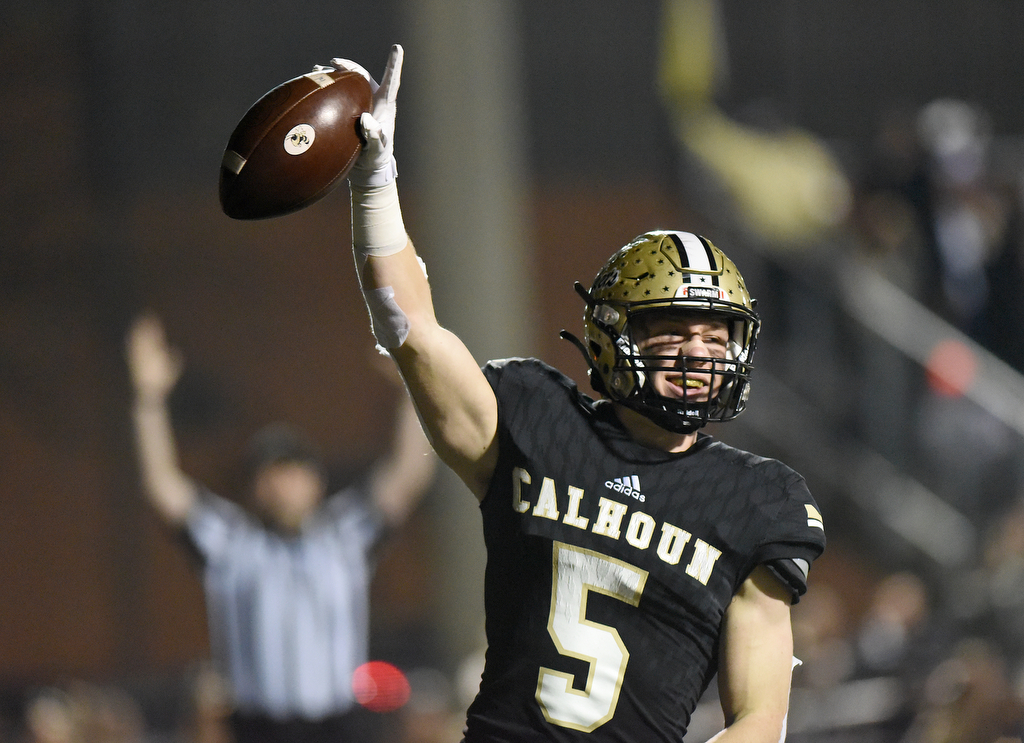 Staff photo by Matt Hamilton / Calhoun's Cole Speer celebrates after scoring a touchdown against Blessed Trinity in a GHSA Class AAAAA semifinal Friday night in Calhoun, Ga.