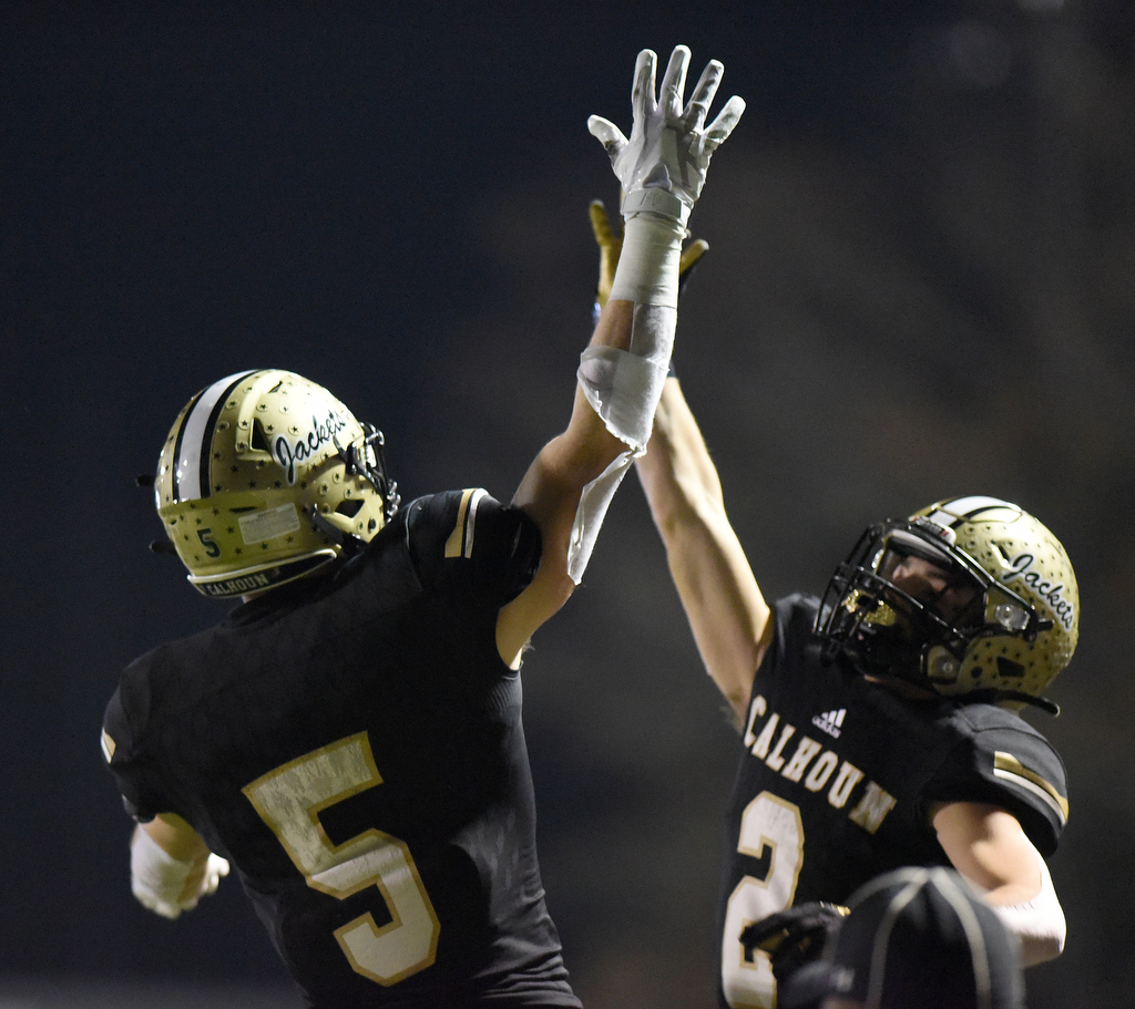 Staff photo by Matt Hamilton / Calhoun receiver Cole Speer (5) celebrates with Brendan Gray after catching a touchdown pass during Friday's GHSA Class AAAAA semifinal win against visiting Blessed Trinity.