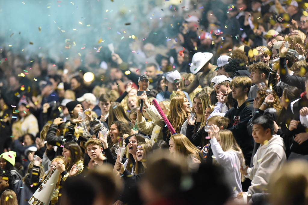 Staff Photo by Matt Hamilton / Calhoun High fans celebrate a touchdown score on Friday, December 3, 2021 in Calhoun, Ga. Calhoun High hosted Blessed Trinity in a GHSA Class 5A football semifinal game Friday.