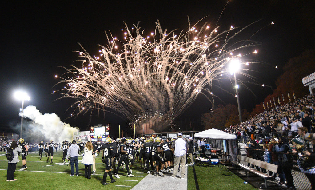 Staff Photo by Matt Hamilton / Calhoun High takes the field as fireworks fill the sky on Friday, December 3, 2021 in Calhoun, Ga. Calhoun High hosted Blessed Trinity in a GHSA Class 5A football semifinal game Friday.