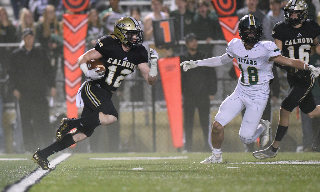 Staff Photo by Matt Hamilton / Calhoun High (12) Dustin Kerns returns the opening kickoff on Friday, December 3, 2021 in Calhoun, Ga. Calhoun High hosted Blessed Trinity in a GHSA Class 5A football semifinal game Friday.