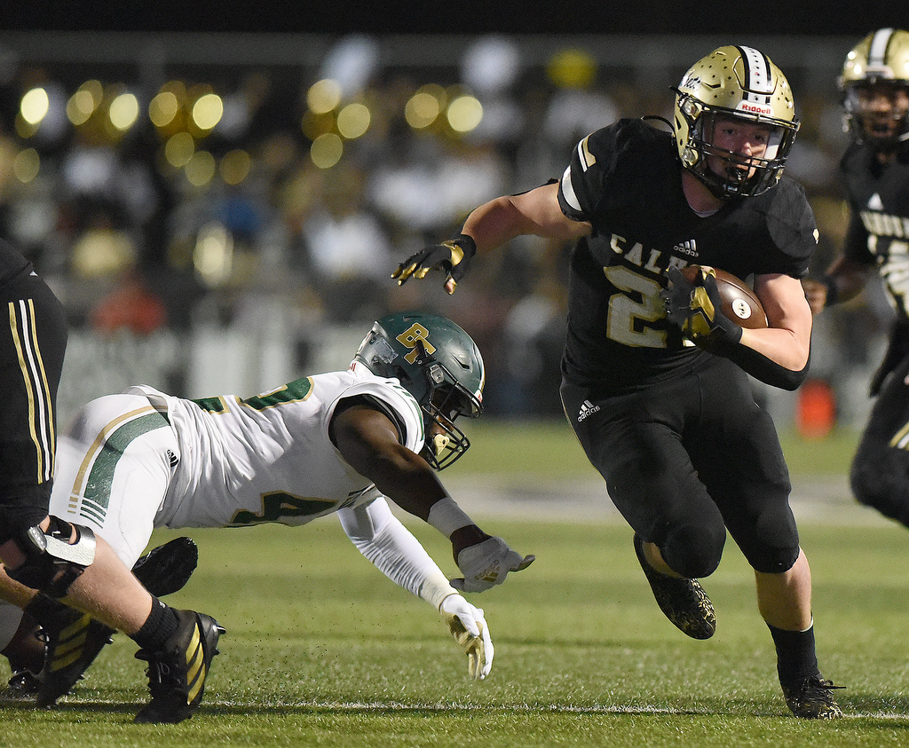 Staff Photo by Matt Hamilton / Calhoun High (21) Caden Williams carries the ball in the red zone on Friday, December 3, 2021 in Calhoun, Ga. Calhoun High hosted Blessed Trinity in a GHSA Class 5A football semifinal game Friday.