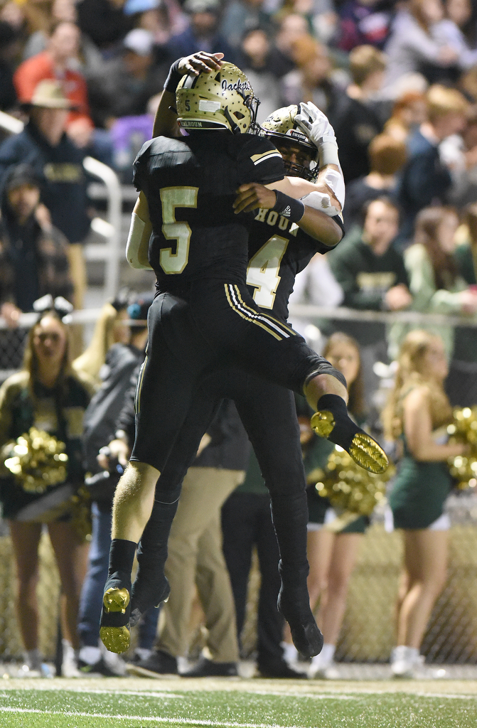 Staff Photo by Matt Hamilton / Calhoun High (5) Cole Speer celebrates with teammate (14) Christian Lewis after catching a touchdown pass on Friday, December 3, 2021 in Calhoun, Ga. Calhoun High hosted Blessed Trinity in a GHSA Class 5A football semifinal game Friday.