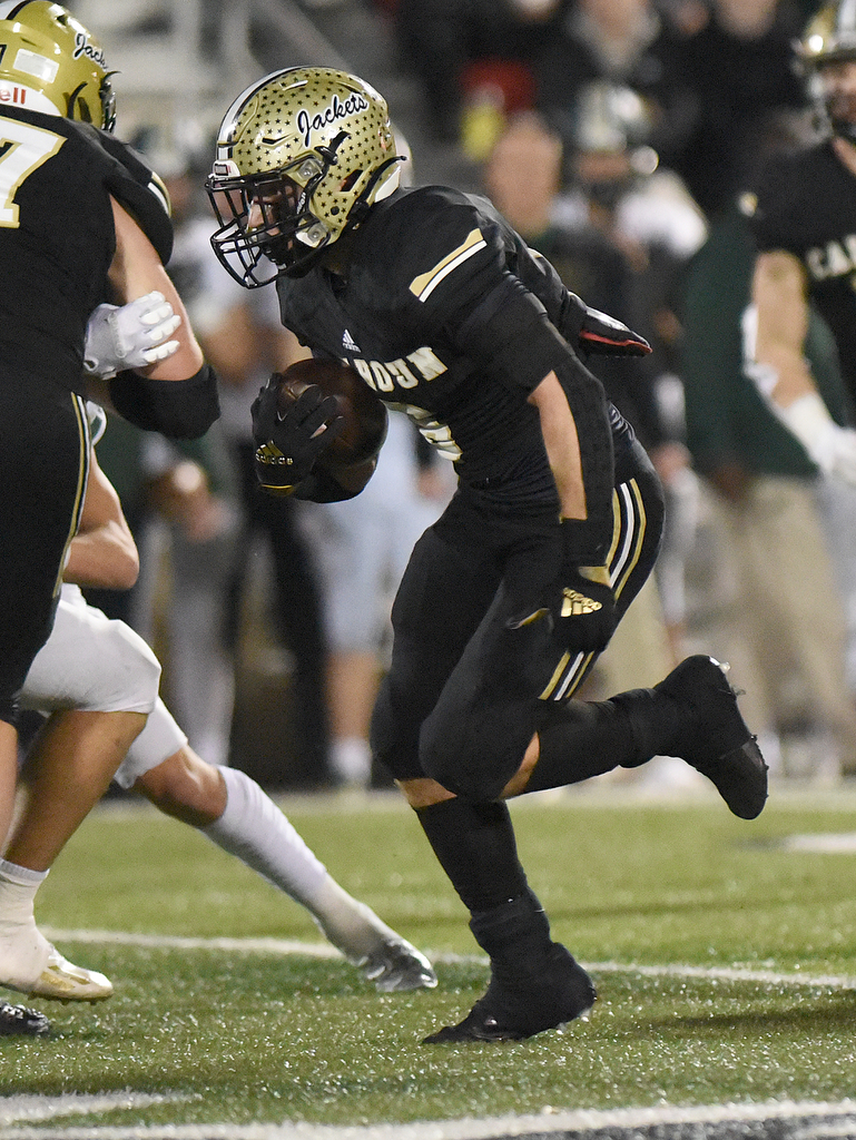 Staff Photo by Matt Hamilton / Calhoun High (6) Gage Leonard carries the ball up the middle Friday, December 3, 2021 in Calhoun, Ga. Calhoun High hosted Blessed Trinity in a GHSA Class 5A football semifinal game Friday.