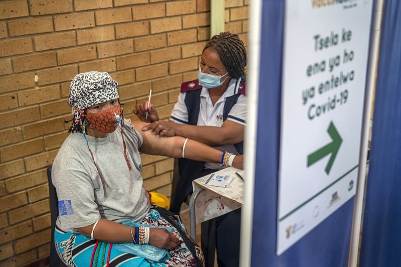 An Orange Farm, South Africa, resident receives her jab against COVID-19 Friday Dec. 3, 2021 at the Orange Farm multipurpose center. South Africa accelerated its vaccination campaign a week after the discovery of the omicron variant of the coronavirus. (AP Photo/Jerome Delay)


