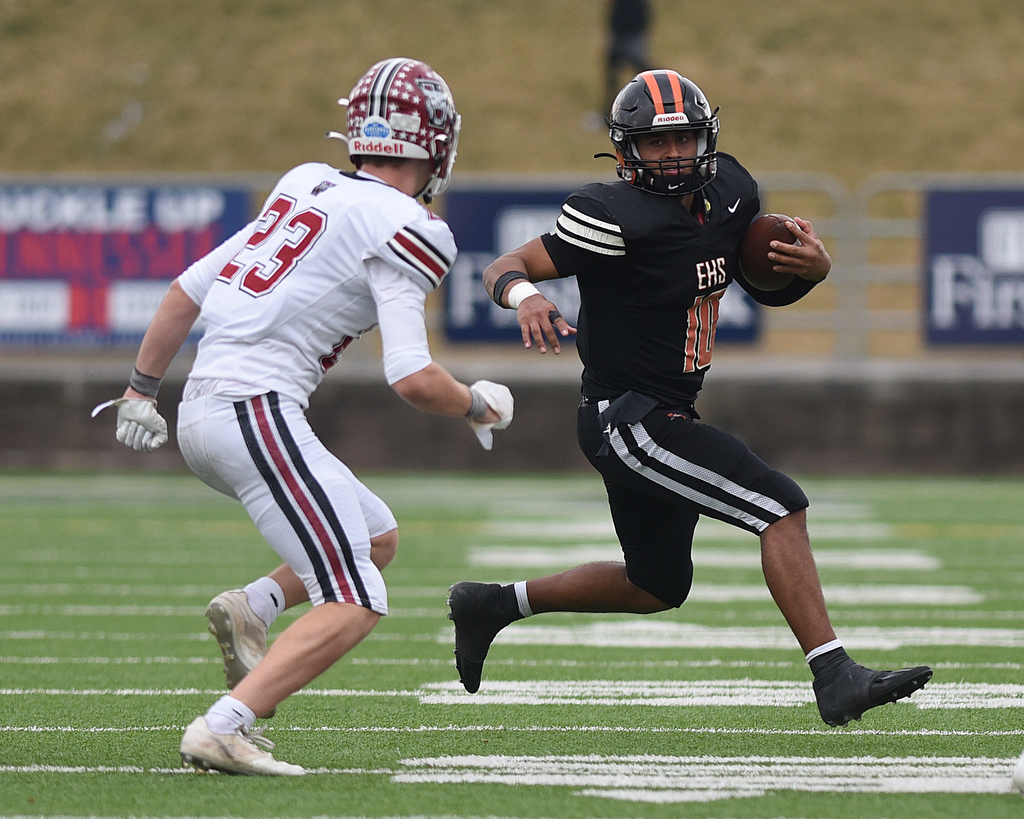 Staff Photo by Matt Hamilton / Tullahoma High (23) Will Partin chases after Elizabethton High (10) Bryson Rollins on Saturday, December 4, 2021 at Finley Stadium during the Class 4A championship game. Tullahoma High defeated Elizabethton 21-14 in double overtime.