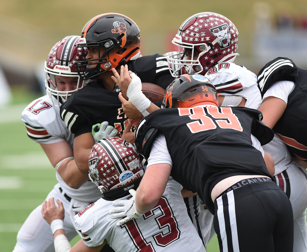 Staff Photo by Matt Hamilton / Tullahoma High defenders hit Elizabethton High (10) Bryson Rollins and push him back on Saturday, December 4, 2021 at Finley Stadium during the Class 4A championship game. Tullahoma High defeated Elizabethton 21-14 in double overtime.