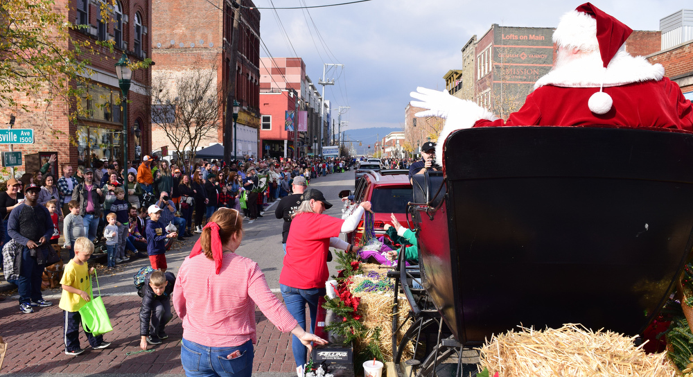 Staff Photo by Robin Rudd / Santa Claus, seated in his sleigh, has a good view of the crowd along Main Street. The 15th annual MAINx24 EPB Southside Parade and street festival took place on December 4, 2021.