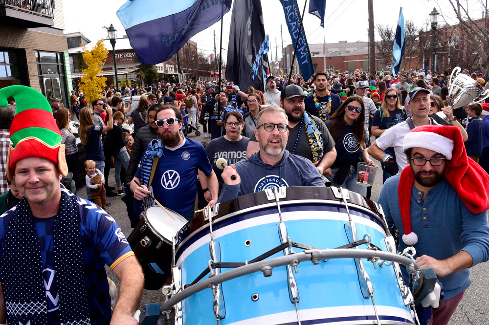 Staff Photo by Robin Rudd / The Chattahooligans beat their drums and waved their CFC flags down Main Street. The 15th annual MAINx24 EPB Southside Parade and street festival took place on December 4, 2021.