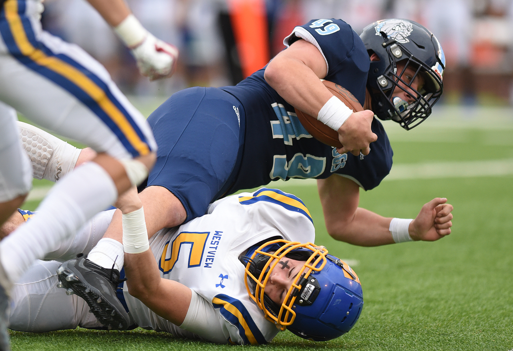 Staff Photo by Matt Hamilton / Westview High School (5) Miles Vincent brings down Hampton High School (49) Ashton Hardin on Saturday, December 4, 2021 at Finley Stadium during the Class 2A championship game. Westview defeated Hampton 55-14 in the championship game.