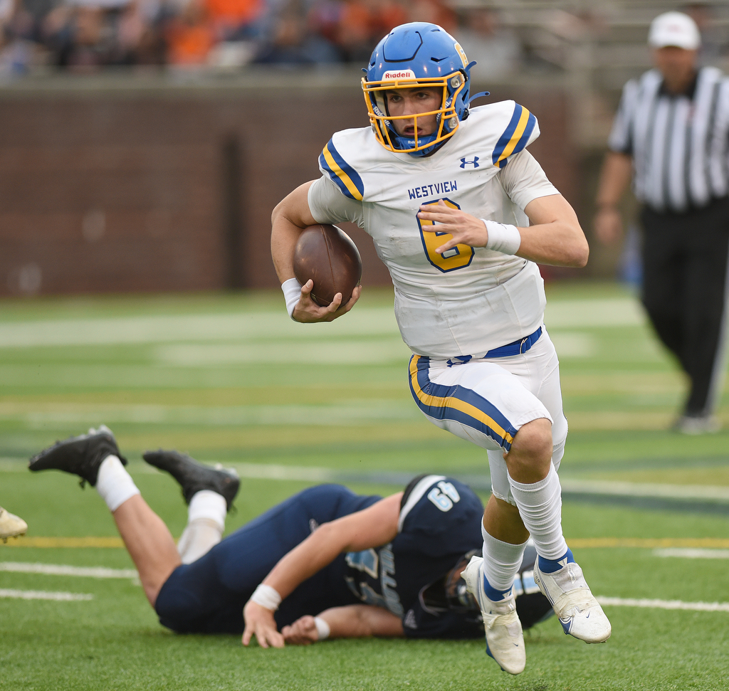 Staff Photo by Matt Hamilton / Westview High School (6) Ty Simpson breaks a tackle as he carries the ball on Saturday, December 4, 2021 at Finley Stadium during the Class 2A championship game. Westview defeated Hampton 55-14 in the championship game.