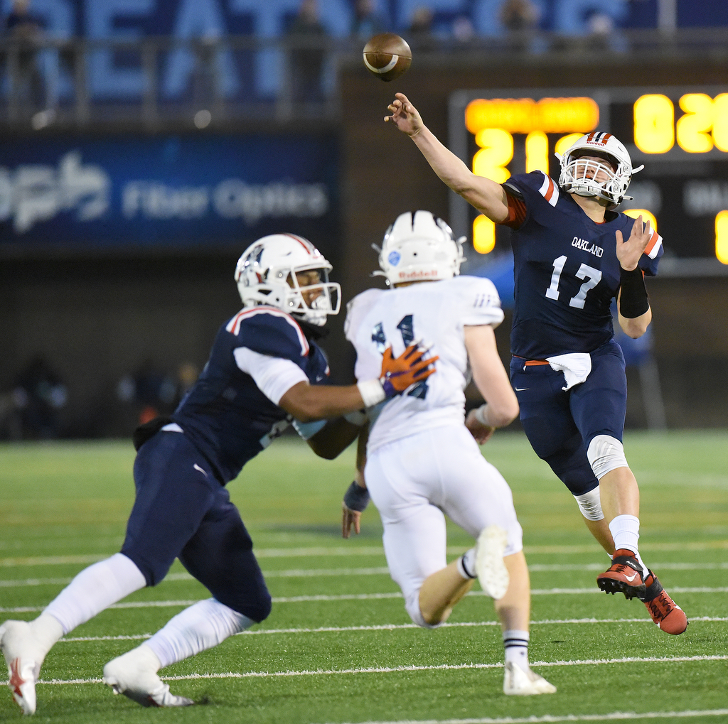 Staff Photo by Matt Hamilton / Oakland High School (17) Kade Hewitt fires a touchdown pass on Saturday, December 4, 2021 at Finley Stadium during the Class 6A championship game.