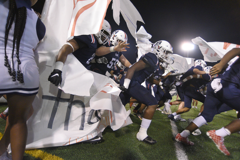 Staff photo by Matt Hamilton / Oakland football players take the field at Finley Stadium for Saturday night's TSSAA Class 6A BlueCross Bowl against Summit.