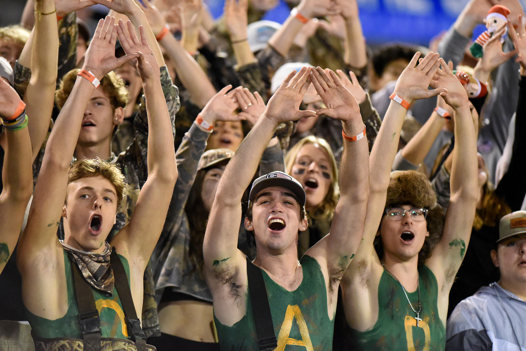 Staff Photo by Matt Hamilton / Oakland High School fans cheer before the opening kickoff on Saturday, December 4, 2021 at Finley Stadium during the Class 6A championship game.