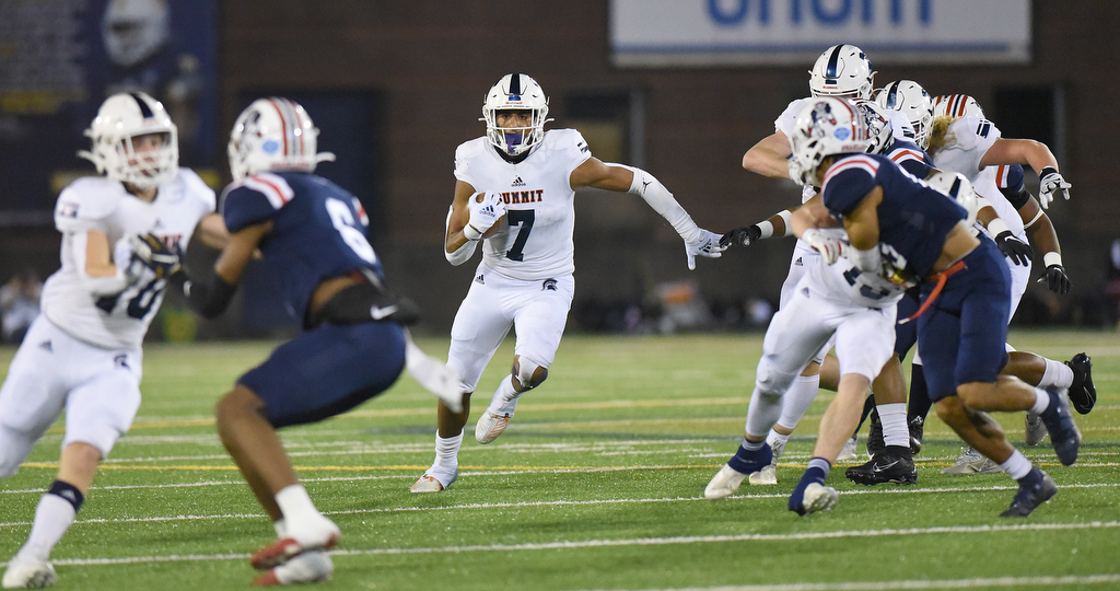 Staff Photo by Matt Hamilton / Summit High School (7) Keaton Wade carries the ball on Saturday, December 4, 2021 at Finley Stadium during the Class 6A championship game.