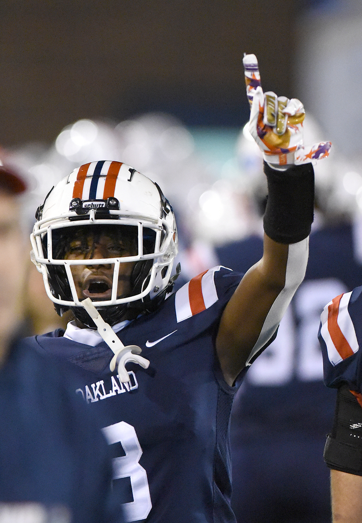Staff Photo by Matt Hamilton / Oakland High School (8) Khalil James celebrates after an Oakland touchdown on Saturday, December 4, 2021 at Finley Stadium during the Class 6A championship game.