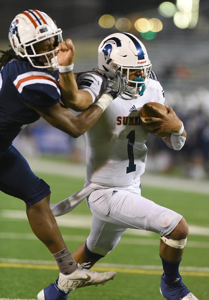 Staff Photo by Matt Hamilton / Oakland High School (26) Korey Smith can't bring down Summit High School (1) Destin Wade as he rambles into the end zone on Saturday, December 4, 2021 at Finley Stadium during the Class 6A championship game.