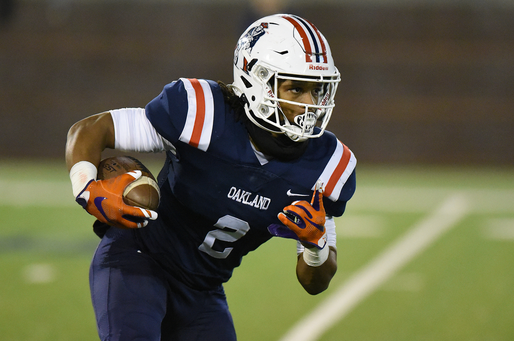 Staff Photo by Matt Hamilton / Oakland High School (2) Jordan James returns a punt on Saturday, December 4, 2021 at Finley Stadium during the Class 6A championship game.