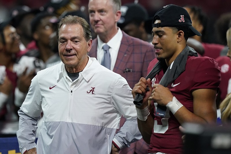 AP photo by Brynn Anderson / Alabama football coach Nick Saban and quarterback Bryce Young celebrate the team's 41-24 win against Georgia at the SEC championship game Saturday in Atlanta.