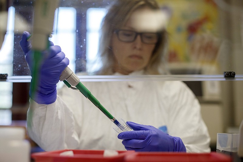 Staff file photo / Dawn Richards works at the Baylor Esoteric and Molecular Laboratory in the Weeks Science Building on the campus of Baylor School on Friday, July 17, 2020, in Chattanooga.