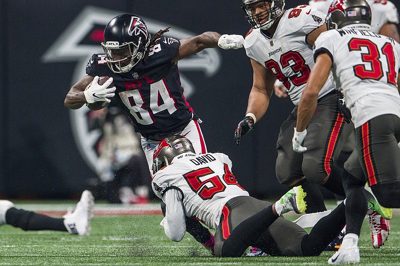 AP photo by Danny Karnik / Atlanta Falcons running back Cordarrelle Patterson (84) is tackled by Tampa Bay Buccaneers inside linebacker Lavonte David during the second half of Sunday's NFC South game at Mercedes-Benz Stadium in Atlanta.