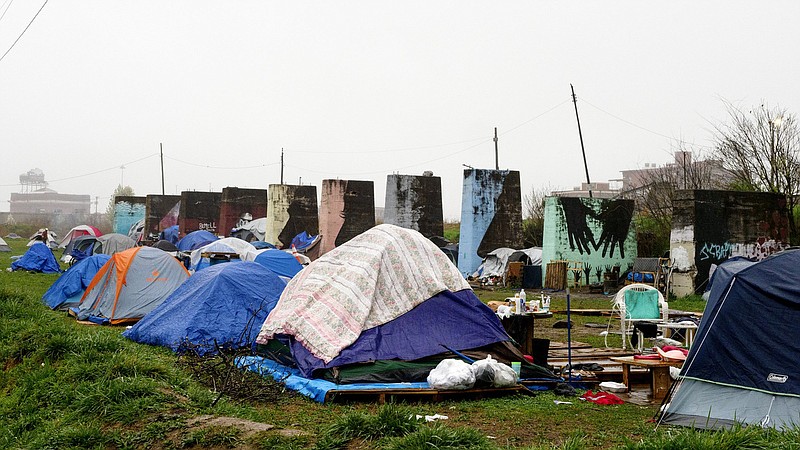 Staff file photo / Tents are seen at a homeless camp off of 11th Street on Wednesday, March 17, 2021, in Chattanooga, Tenn.