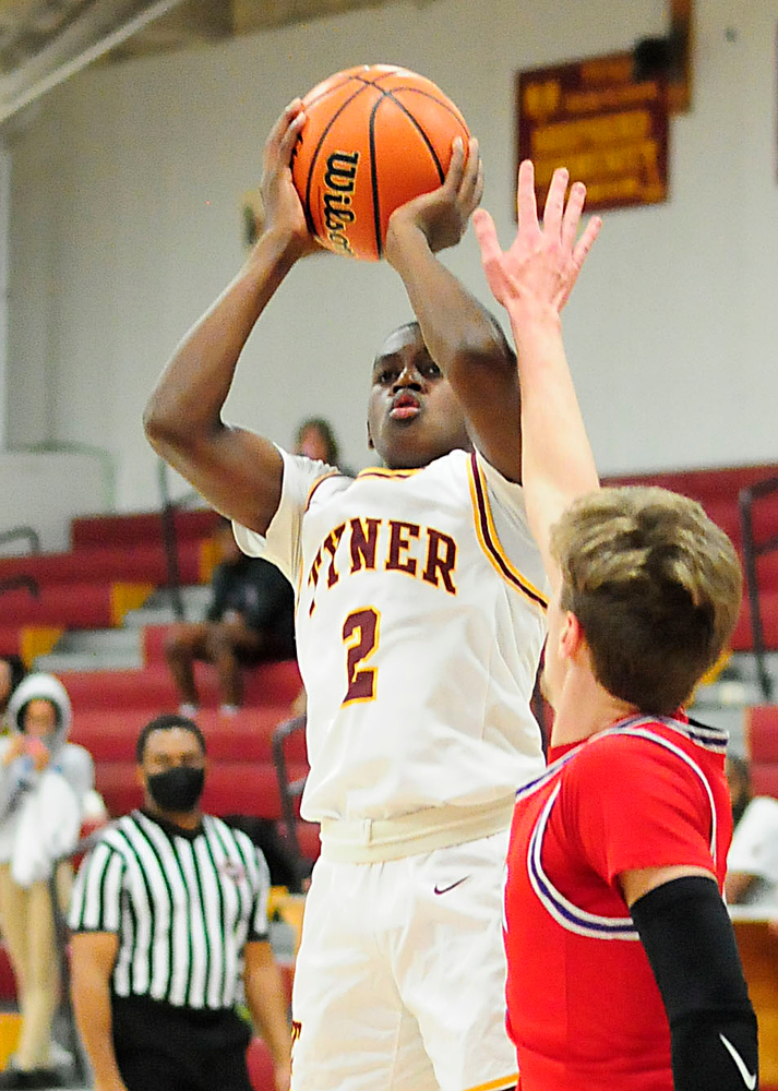 Staff Photo by Robin Rudd / Tyner's Rodney Henderson (2) throws up a three-point shot. The Polk County Wildcats visited the Tyner Rams in TSSAA boy's basketball on December 7, 2021.