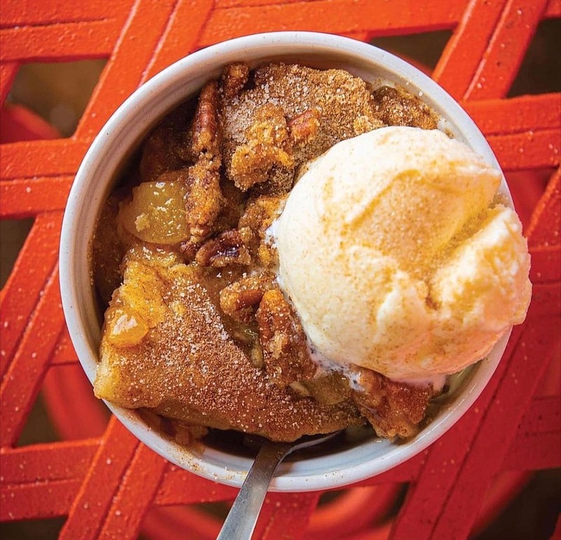 Photo courtesy of Peach Cobbler Factory / Peach Cobbler Factory restaurants offer 12 kinds of peach cobbler served with a scoop of vanilla ice cream.