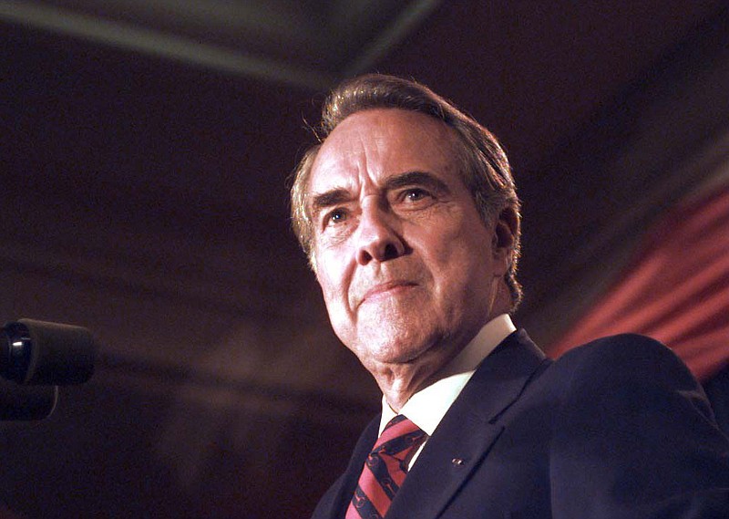 File photo by Stephen Crowley of The New York Times / Bob Dole, then-Republican presidential candidate, prepares to give his concession speech after losing to Bill Clinton, in Washington, Nov. 5, 1996. Dole died on Sunday, Dec. 5, 2021. He was 98.