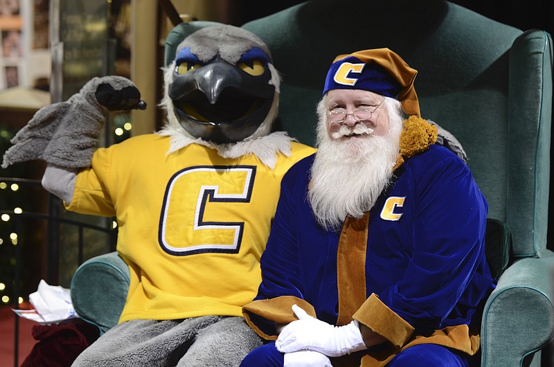 Staff File Photo / Mascot Scrappy, left, and Santa Mocs, wearing blue and gold, will pose for photos with University of Chattanooga fans Tuesday evening at Northgate Mall. Visits are free. Photo packages vary in price.