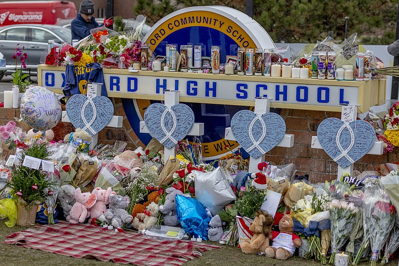 Photo by Sylvia Jarrus of The New York Times / A makeshift memorial outside of Oxford High School in Oxford, Mich., is shown on Dec. 3, 2021.