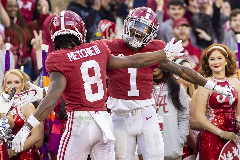 AP file photo by Vasha Hunt / Alabama wide receivers John Metchie III and Jameson Williams, right, have been the top targets this season for Bryce Young, but the Crimson Tide head into the College Football Playoff knowing Metchie will miss the remainder of the season due to injury.