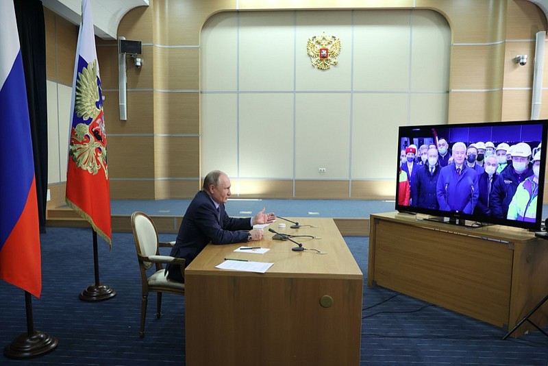 Russian President Vladimir Putin takes part in a ceremony to open ten new stations of the Big Circle Line of the Moscow subway via videoconference at the Bocharov Ruchei residence in the Black Sea resort of Sochi, Russia, Tuesday, Dec. 7, 2021. (Mikhail Metzel, Sputnik, Kremlin Pool Photo via AP)


