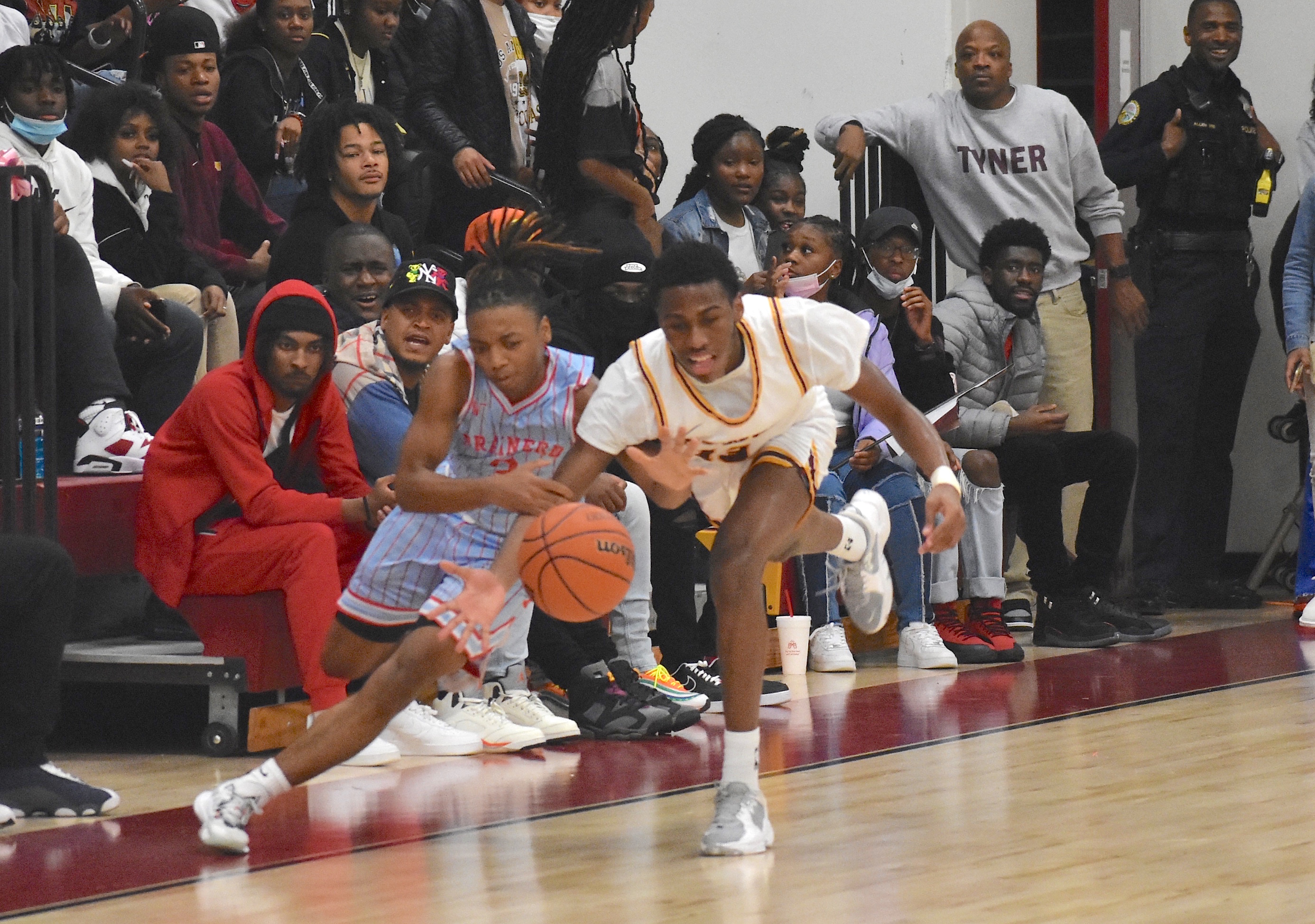 Staff photo by Patrick MacCoon / Brainerd guard Dennis Lewis Jr. and Tyner's Keelan Jackson go after a loose ball in Friday's home victory for the Rams.