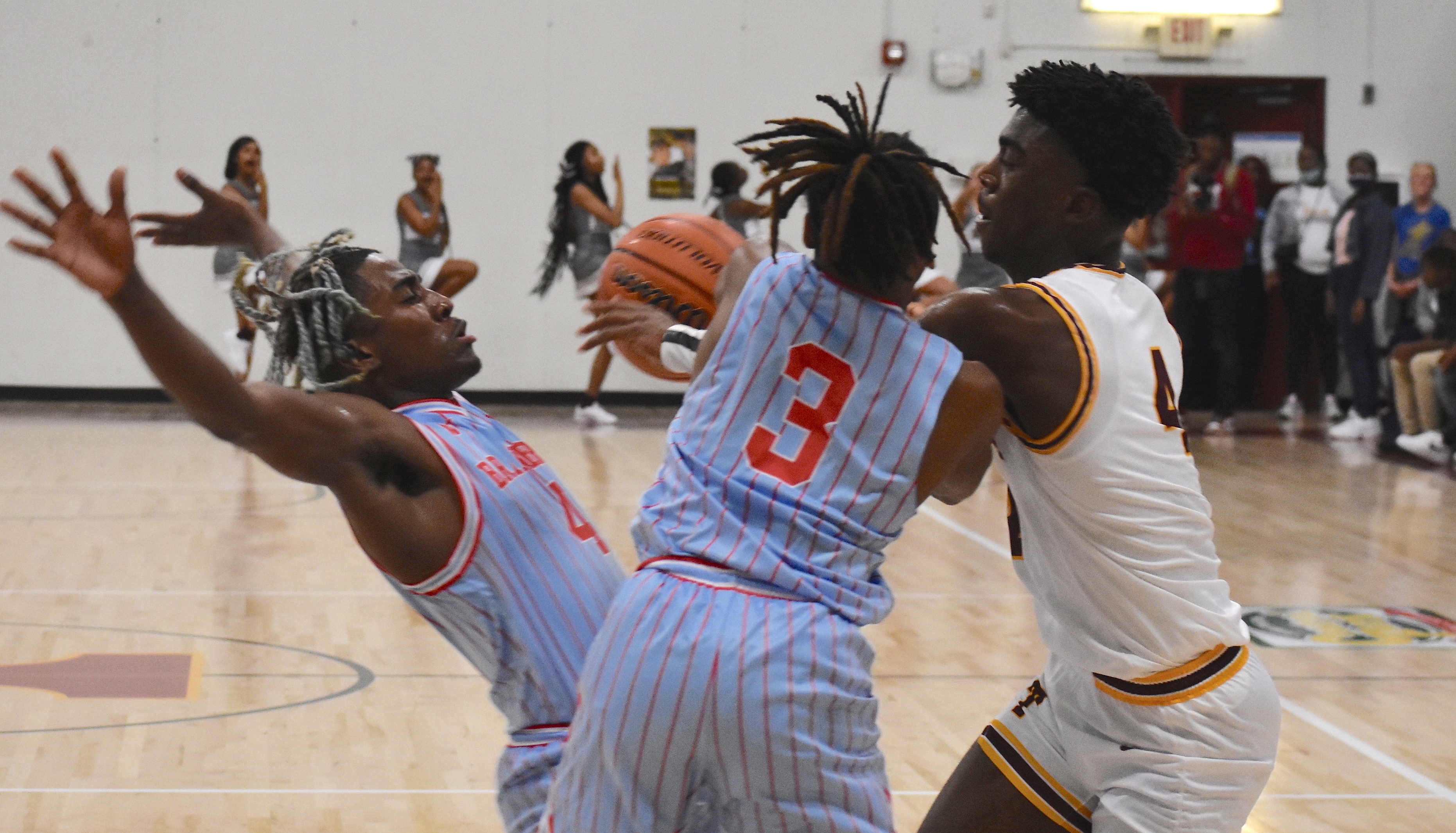 Staff photo by Patrick MacCoon / Brainerd defenders draw an offensive foul in the first half against Tyner on Friday night.