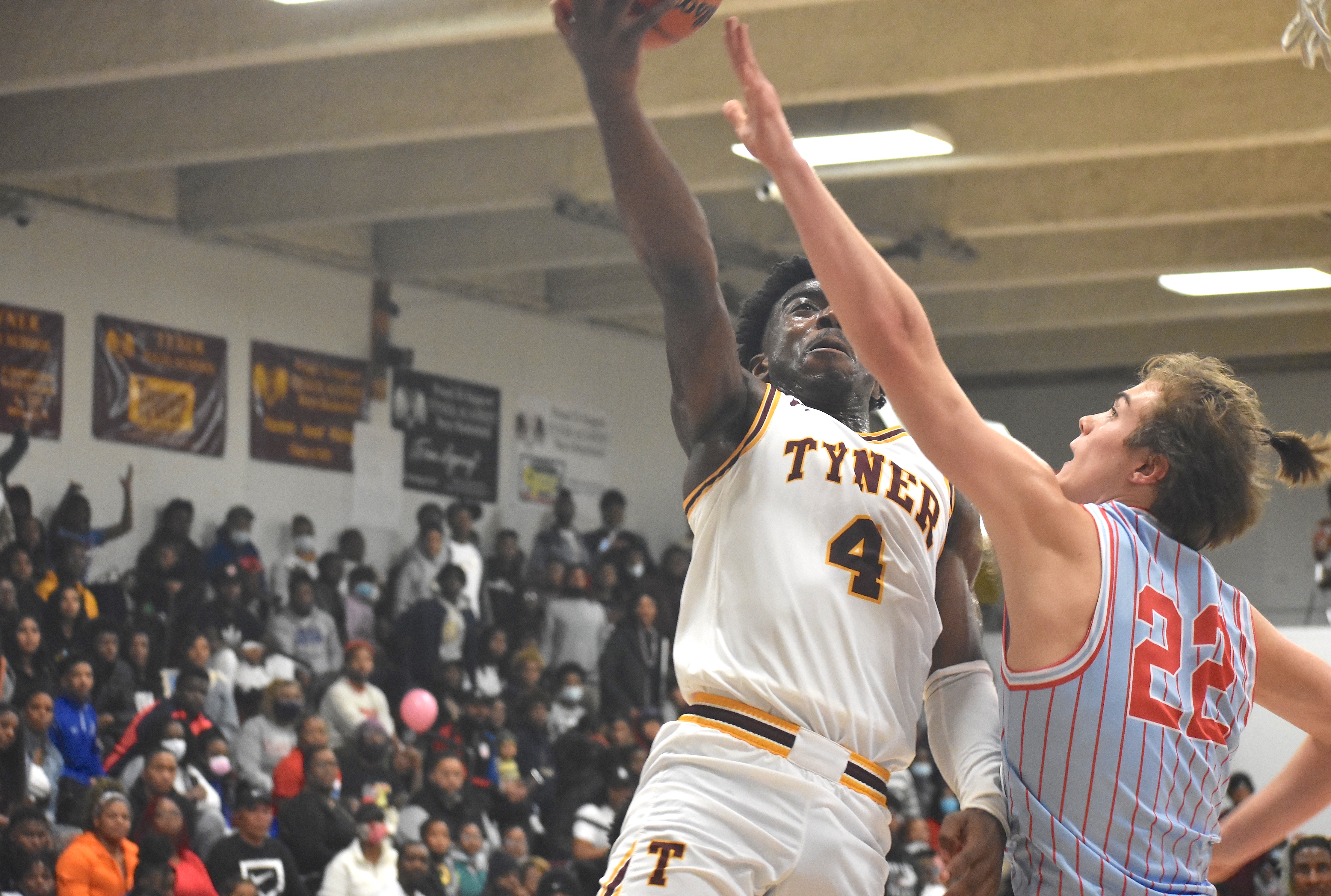 Staff photo by Patrick MacCoon / Tyner junior Nehemiah Bloodsaw rises towards the rim during Friday's home contest against Brainerd.